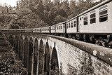 Vintage Train Crossing Arched Bridge